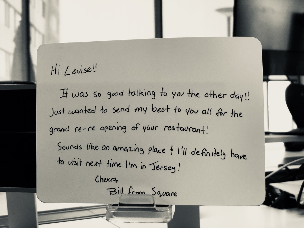 A handwritten note congratulating a customer on a restaurant reopening.